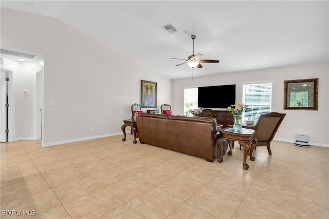 1402 Congress Ave, Lehigh Acres, FL 33972 - living area with ceiling fan, vaulted ceiling, light tile patterned floors, and baseboards