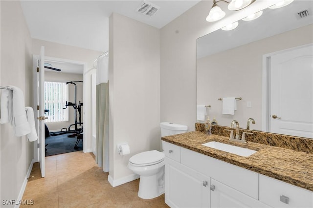 1402 Congress Ave, Lehigh Acres, FL 33972 - bathroom featuring vanity, baseboards, toilet, and tile patterned floors