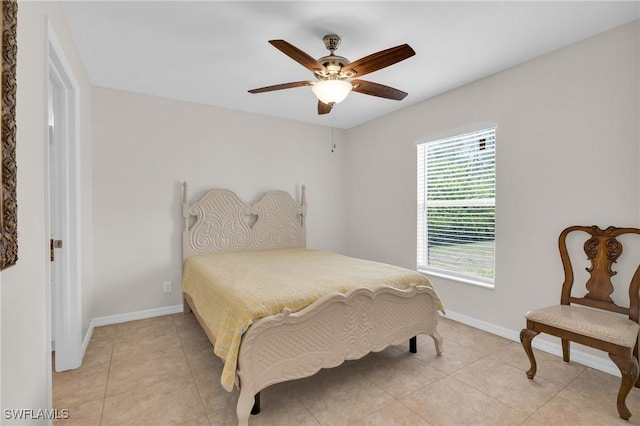 1402 Congress Ave, Lehigh Acres, FL 33972 - bedroom with baseboards, light tile patterned floors, and a ceiling fan