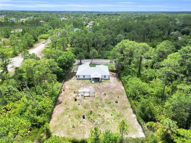 1402 Congress Ave, Lehigh Acres, FL 33972 - aerial view of property and surrounding area with a forest