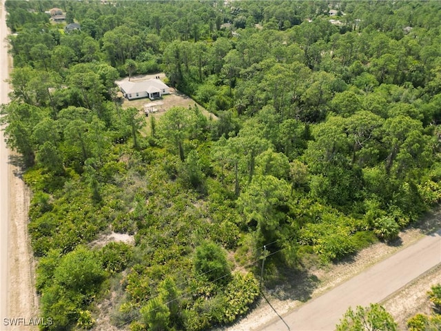 1402 Congress Ave, Lehigh Acres, FL 33972 - drone / aerial view of a heavily wooded area