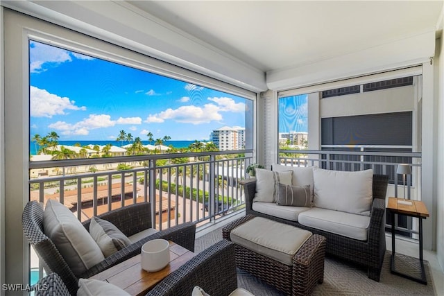2600 Gulf Shore Blvd N Unit 54, Naples, FL 34103 - balcony featuring a water view and an outdoor living space
