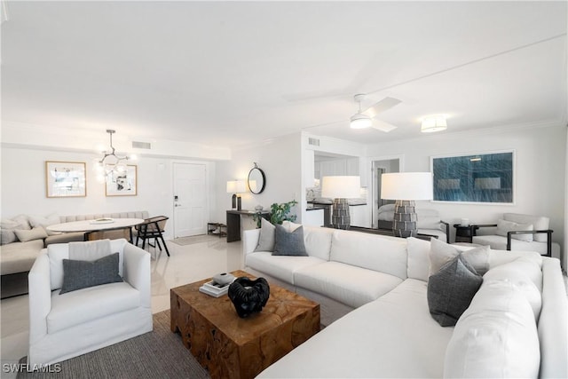2600 Gulf Shore Blvd N Unit 54, Naples, FL 34103 - living room with crown molding, a ceiling fan, and a chandelier
