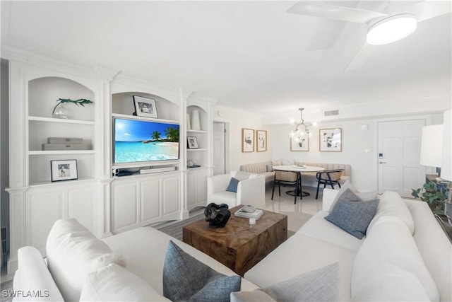 2600 Gulf Shore Blvd N Unit 54, Naples, FL 34103 - living room featuring a chandelier and built in features