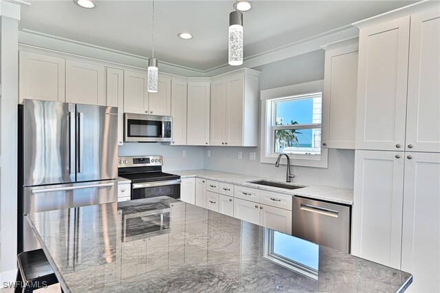 26275 Hickory Blvd Unit 26, Bonita Springs, FL 34134 - kitchen with appliances with stainless steel finishes, a sink, a breakfast bar, white cabinetry, and recessed lighting