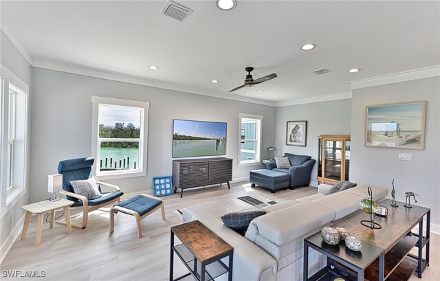 26275 Hickory Blvd Unit 26, Bonita Springs, FL 34134 - living room featuring light wood-type flooring, crown molding, recessed lighting, baseboards, and ceiling fan