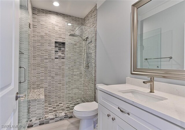 26275 Hickory Blvd Unit 26, Bonita Springs, FL 34134 - bathroom with vanity, a shower stall, toilet, and recessed lighting