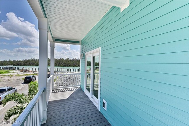 26275 Hickory Blvd Unit 26, Bonita Springs, FL 34134 - wooden terrace featuring a water view