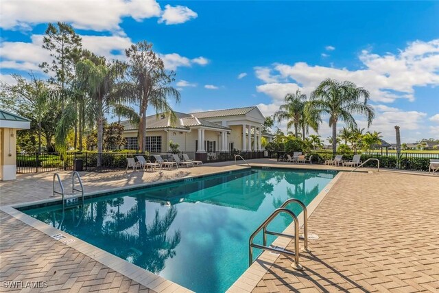 3659 Rollingwater Way N, Fort Myers, FL 33917 - community pool featuring a patio area