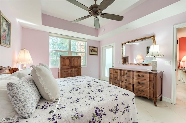 10800 Palazzo Way Unit 204, Fort Myers, FL 33913 - bedroom featuring baseboards, tile patterned floors, ceiling fan, and a tray ceiling