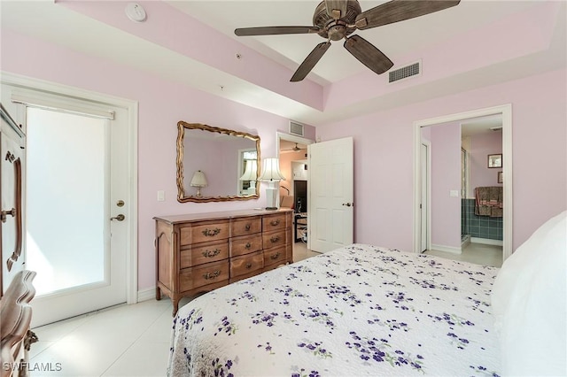 10800 Palazzo Way Unit 204, Fort Myers, FL 33913 - bedroom with a raised ceiling, light tile patterned floors, a ceiling fan, ensuite bathroom, and baseboards