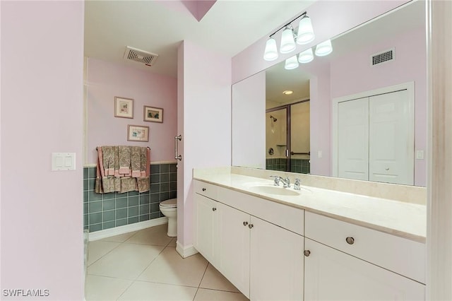 10800 Palazzo Way Unit 204, Fort Myers, FL 33913 - full bath featuring toilet, vanity, tile walls, tile patterned floors, and a shower with shower door