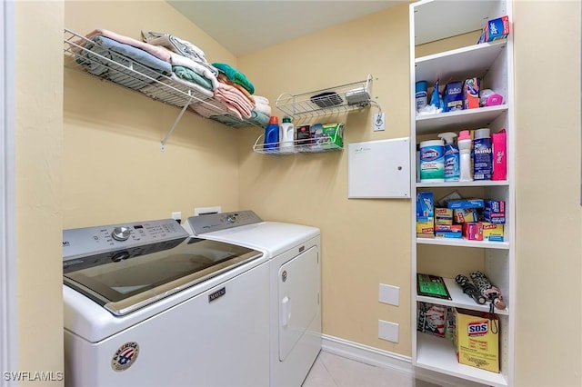 10800 Palazzo Way Unit 204, Fort Myers, FL 33913 - laundry area featuring washer and dryer, tile patterned floors, and baseboards