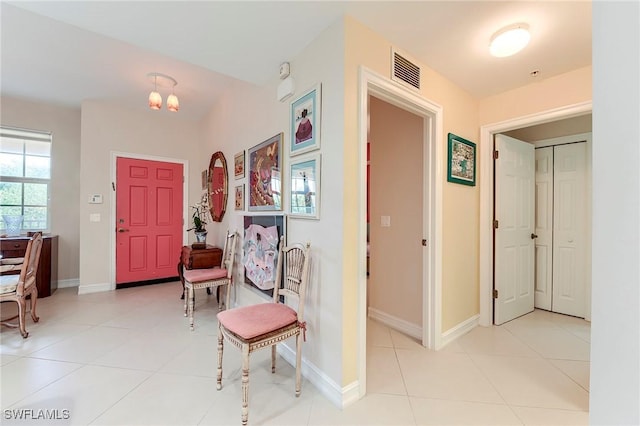 10800 Palazzo Way Unit 204, Fort Myers, FL 33913 - entrance foyer featuring light tile patterned floors, baseboards, and a chandelier
