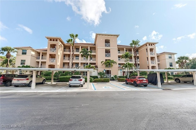 10800 Palazzo Way Unit 204, Fort Myers, FL 33913 - view of apartment building / complex featuring covered and uncovered parking