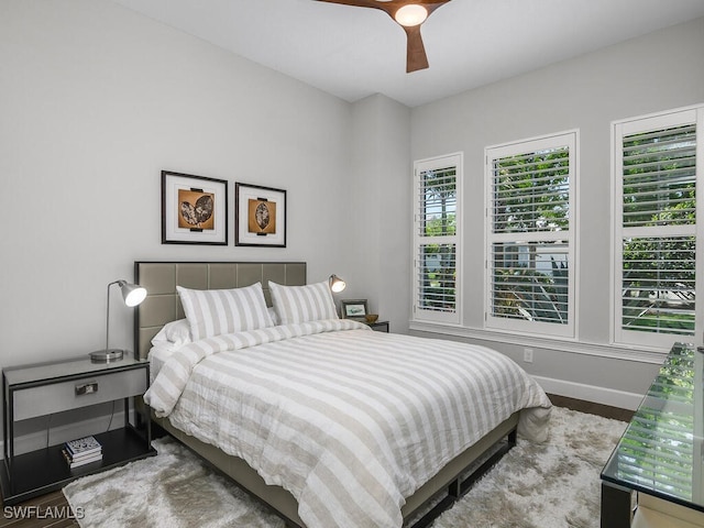 6478 Warwick Ave, Naples, FL 34113 - bedroom with wood finished floors, baseboards, and a ceiling fan