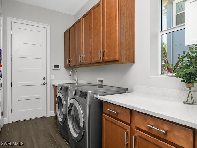 6478 Warwick Ave, Naples, FL 34113 - laundry room featuring cabinet space, washing machine and clothes dryer, dark wood finished floors, and baseboards