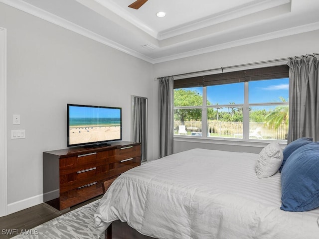 6478 Warwick Ave, Naples, FL 34113 - bedroom featuring wood finished floors, a raised ceiling, ornamental molding, recessed lighting, and baseboards