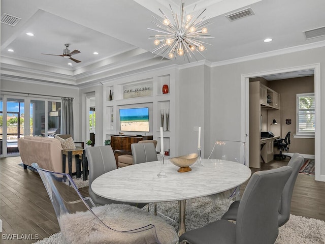 6478 Warwick Ave, Naples, FL 34113 - dining room with crown molding, wood finished floors, a raised ceiling, a ceiling fan, and a chandelier