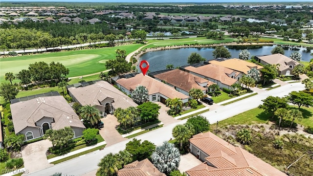 8836 Savona Ct, Naples, FL 34119 - aerial perspective of suburban area featuring a local golf course and a nearby body of water