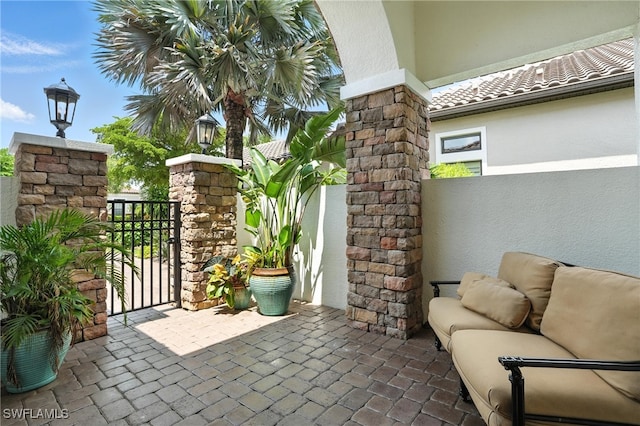 8836 Savona Ct, Naples, FL 34119 - view of patio featuring a gate