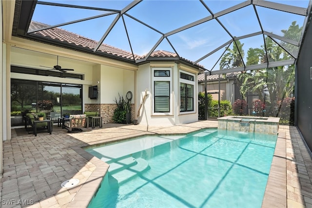 8836 Savona Ct, Naples, FL 34119 - view of swimming pool with a patio area, a pool with connected hot tub, ceiling fan, and glass enclosure