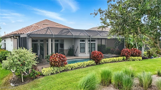 8836 Savona Ct, Naples, FL 34119 - rear view of property featuring stucco siding, a yard, a patio area, a lanai, and an outdoor pool