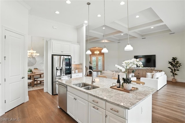 8836 Savona Ct, Naples, FL 34119 - kitchen featuring stainless steel appliances, open floor plan, ornamental molding, coffered ceiling, and beamed ceiling