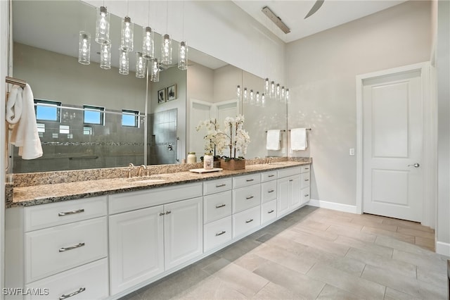 8836 Savona Ct, Naples, FL 34119 - bathroom featuring double vanity and a stall shower