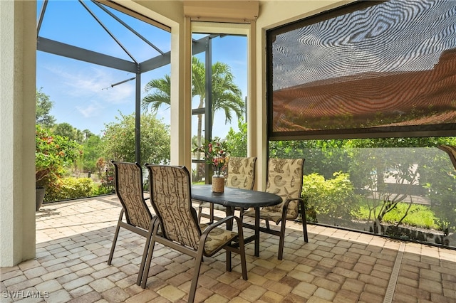8836 Savona Ct, Naples, FL 34119 - sunroom / solarium featuring outdoor dining space