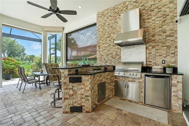 8836 Savona Ct, Naples, FL 34119 - view of patio with exterior kitchen, a ceiling fan, and glass enclosure