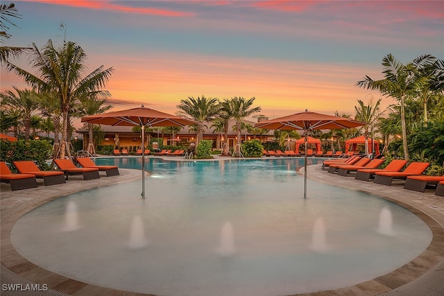 8836 Savona Ct, Naples, FL 34119 - community pool featuring a patio