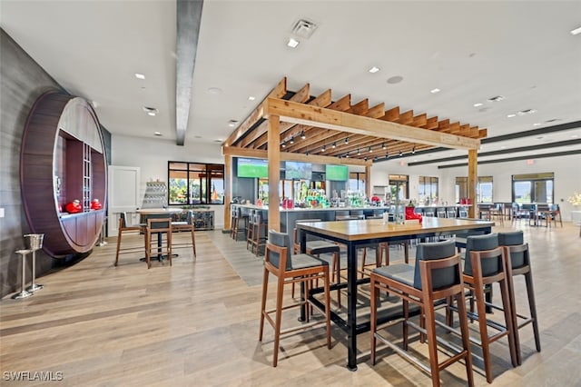 8836 Savona Ct, Naples, FL 34119 - bar featuring healthy amount of natural light, light wood-style flooring, and recessed lighting