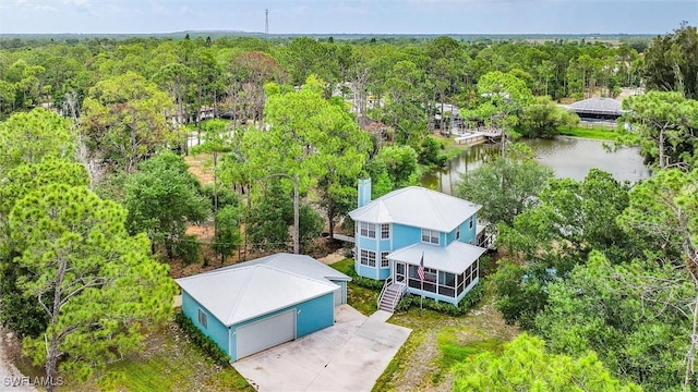 20433 Fern Cir, North Fort Myers, FL 33917 - aerial view of property and surrounding area featuring a forest and a nearby body of water