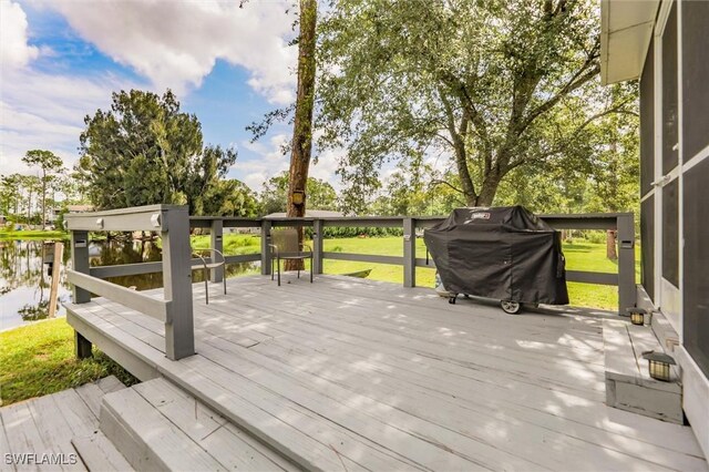 20433 Fern Cir, North Fort Myers, FL 33917 - deck with a grill and a yard