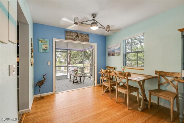 20433 Fern Cir, North Fort Myers, FL 33917 - dining room with light wood-style floors and a ceiling fan