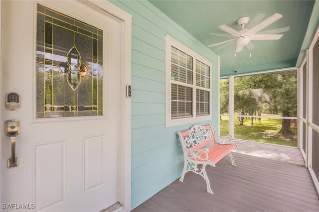 20433 Fern Cir, North Fort Myers, FL 33917 - doorway to property with covered porch and ceiling fan
