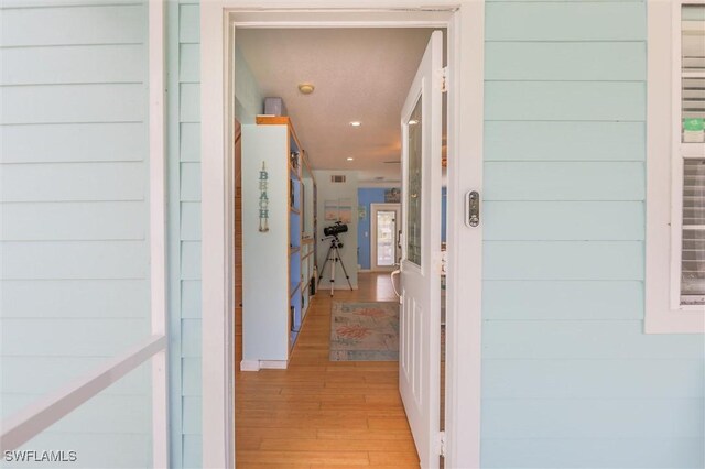 20433 Fern Cir, North Fort Myers, FL 33917 - corridor with light wood-style floors and recessed lighting