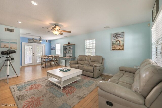 20433 Fern Cir, North Fort Myers, FL 33917 - living area with plenty of natural light, light wood-style floors, french doors, and recessed lighting