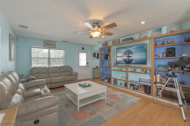 20433 Fern Cir, North Fort Myers, FL 33917 - living room with ceiling fan, wood finished floors, and recessed lighting