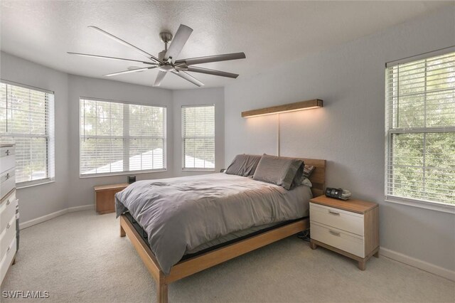 20433 Fern Cir, North Fort Myers, FL 33917 - bedroom featuring multiple windows and light colored carpet