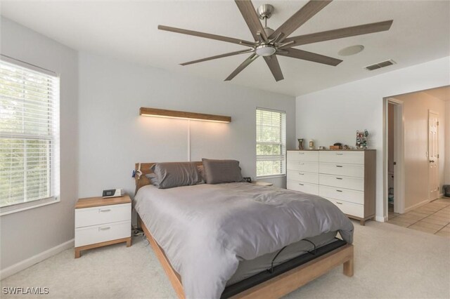 20433 Fern Cir, North Fort Myers, FL 33917 - bedroom featuring light colored carpet and a ceiling fan