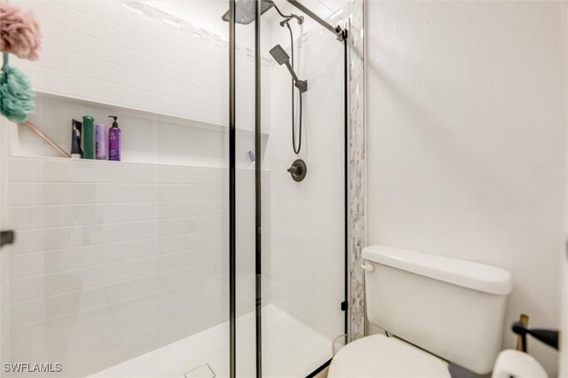 20433 Fern Cir, North Fort Myers, FL 33917 - full bathroom with toilet and a shower stall