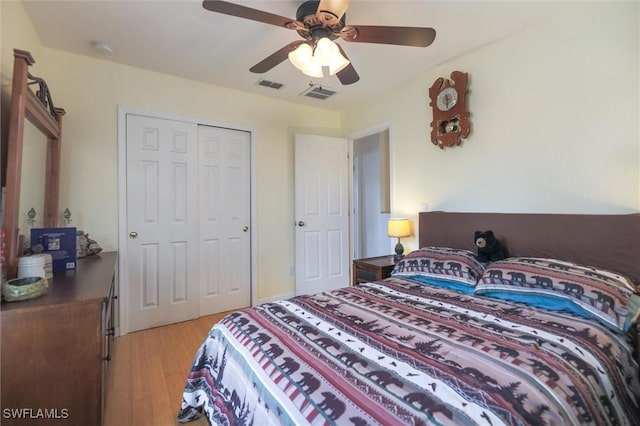 20433 Fern Cir, North Fort Myers, FL 33917 - bedroom featuring light wood finished floors, a closet, and a ceiling fan