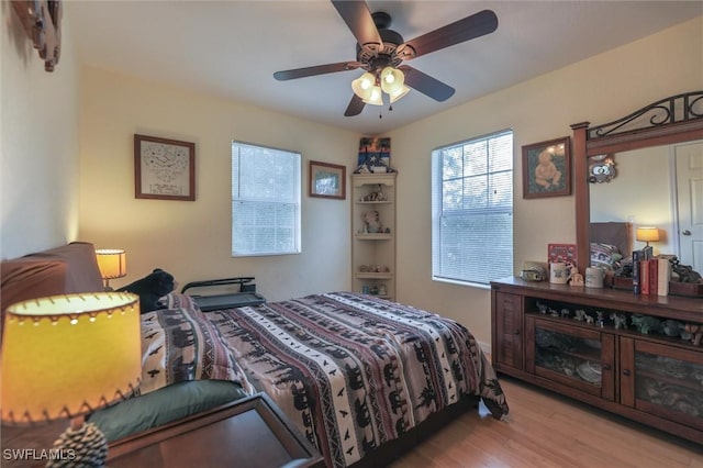20433 Fern Cir, North Fort Myers, FL 33917 - bedroom featuring wood finished floors and a ceiling fan