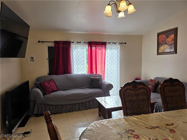 328 Harold Ave S, Lehigh Acres, FL 33973 - living room with light tile patterned flooring and a chandelier