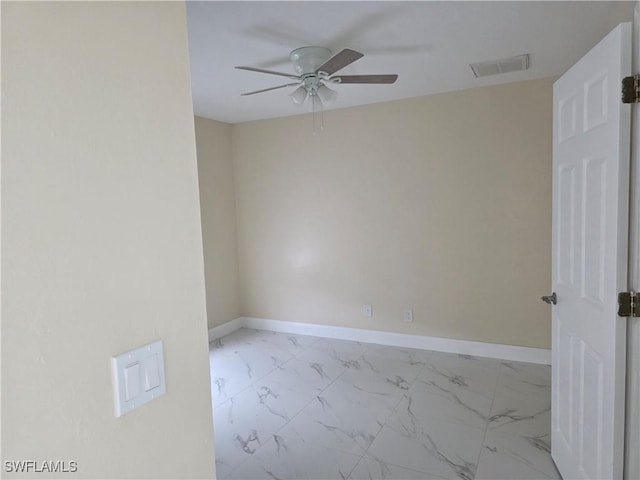328 Harold Ave S, Lehigh Acres, FL 33973 - spare room with ceiling fan and marble look tile flooring