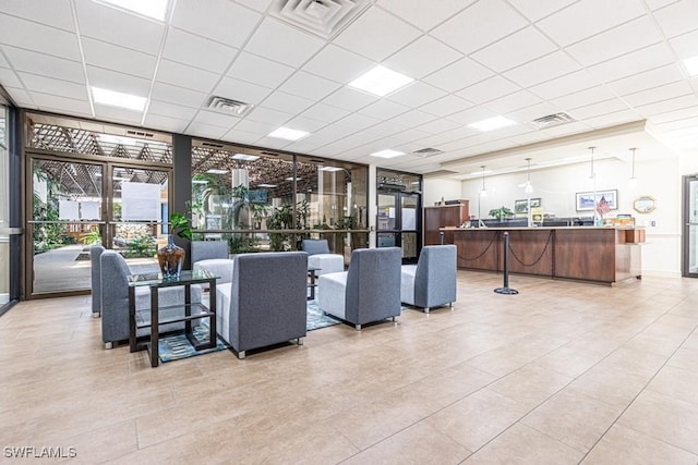 7430 Lake Breeze Dr Unit 403, Fort Myers, FL 33907 - community lobby with a paneled ceiling and expansive windows