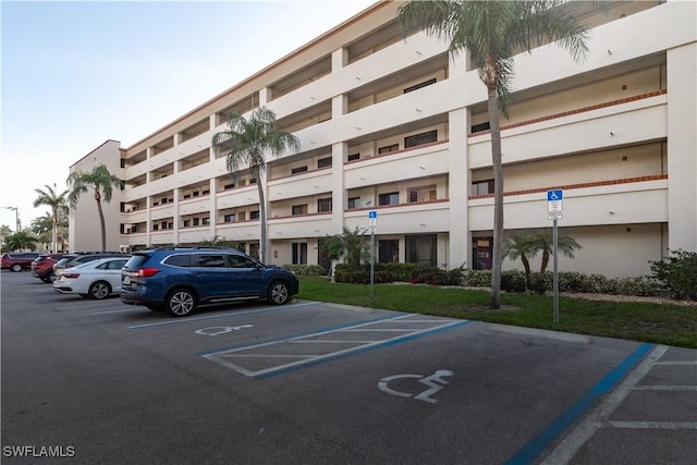 7430 Lake Breeze Dr Unit 403, Fort Myers, FL 33907 - view of building exterior with uncovered parking