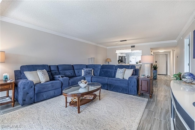 7430 Lake Breeze Dr Unit 403, Fort Myers, FL 33907 - living area featuring a textured ceiling, ornamental molding, and wood tiled floors